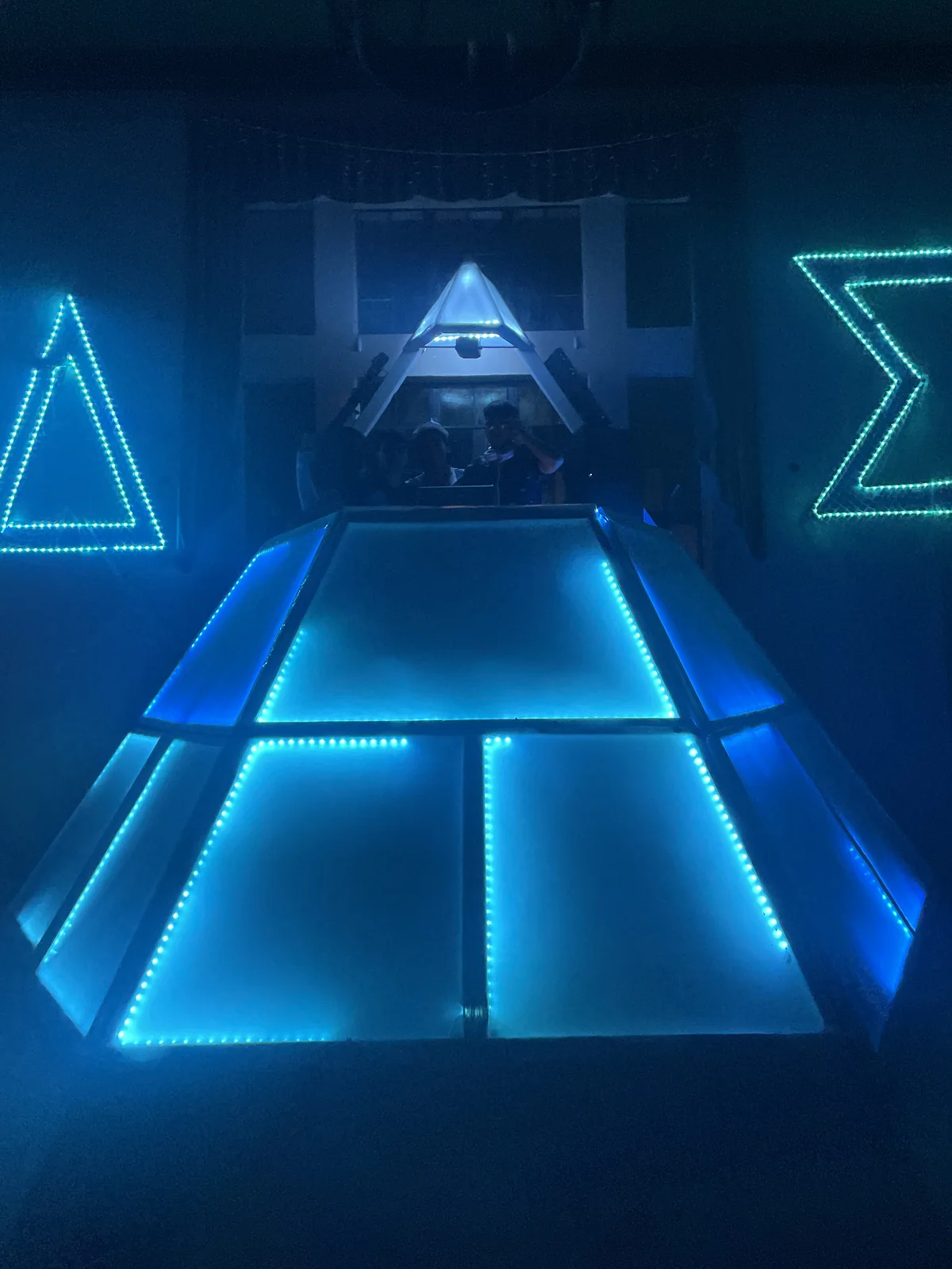 Completed collapsible 21-foot DJ pyramid and its construction
